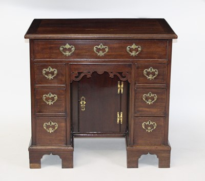 Lot 2680 - A George III mahogany kneehole desk, having an...