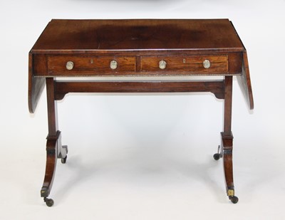 Lot 2685 - A late Regency rosewood sofa table, having...