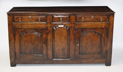 Lot 2692 - A George III joined oak dresser base, having a...