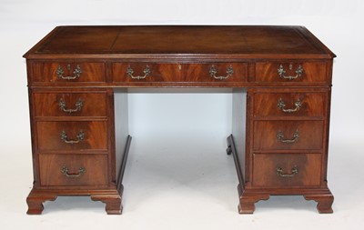 Lot 2699 - A mahogany twin pedestal desk in the Georgian...