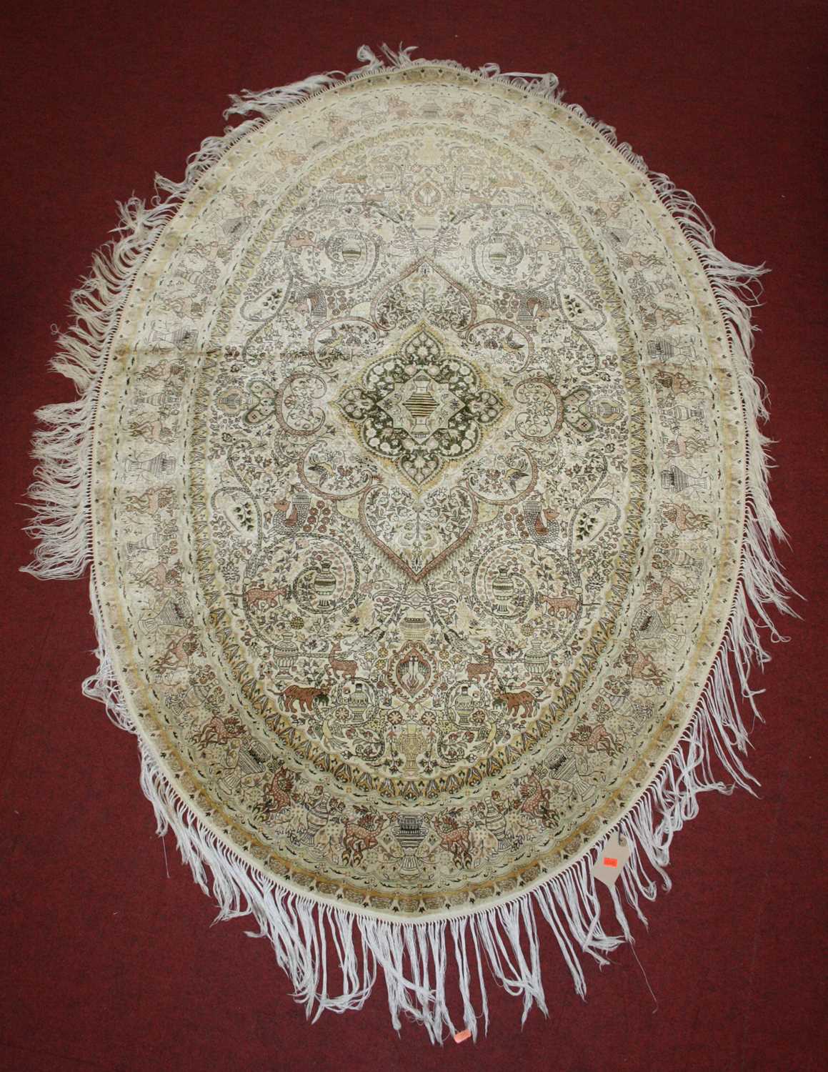 Lot 2671 - A Persian fineweave oval silk rug, having a...