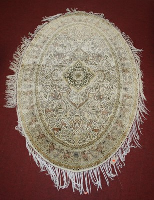 Lot 2671 - A Persian fineweave oval silk rug, having a...