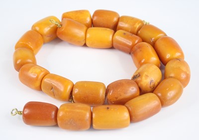 Lot 2226 - A heavy beaded butterscotch amber single...