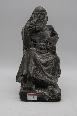 Lot 11 - A plaster figure of a seated man upon a square...