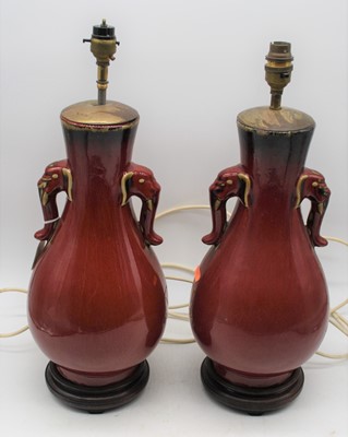 Lot 15 - A pair of Chinese sang-de-boeuf vases, later...