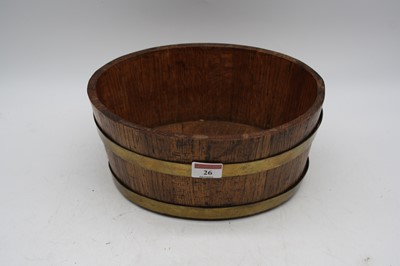 Lot 26 - A brass coopered oak jardiniere, of oval form,...