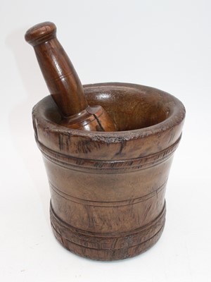 Lot 44 - A turned sycamore pestle and mortar, the...