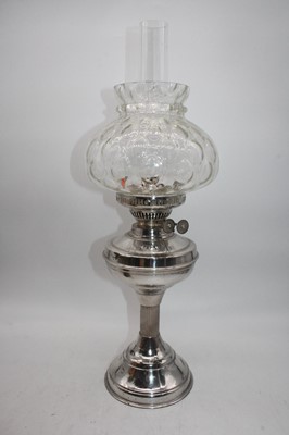 Lot 108 - A copper oil lamp, having a floral moulded and...