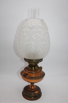 Lot 108 - A copper oil lamp, having a floral moulded and...
