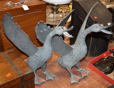 Lot 129 - A pair of cast metal models of swans, h.41cm