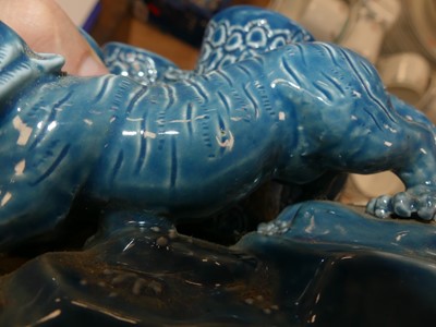 Lot 137 - A Chinese blue glazed model of a tiger, h.12cm