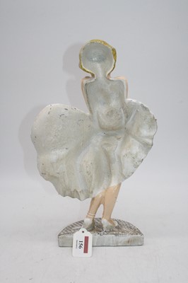 Lot 156 - A cast iron doorstop in the form of Marilyn...
