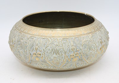 Lot 63 - An eastern repoussee decorated brass bowl, dia....