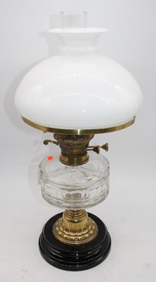 Lot 162 - A 19th century oil lamp, having milk glass...