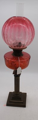 Lot 183 - A 19th century brass oil lamp, having acid...