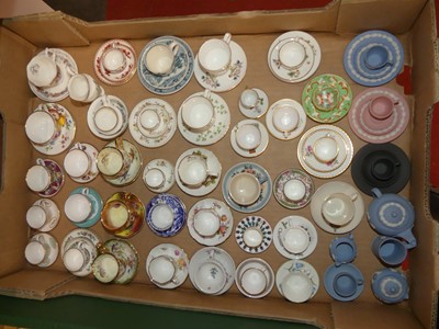 Lot 89 - A collection of miniature teacups and saucers...