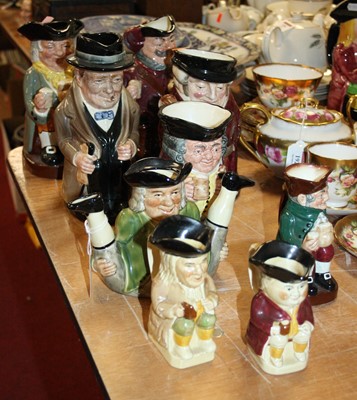Lot 135 - A collection of nine Toby jugs to include...