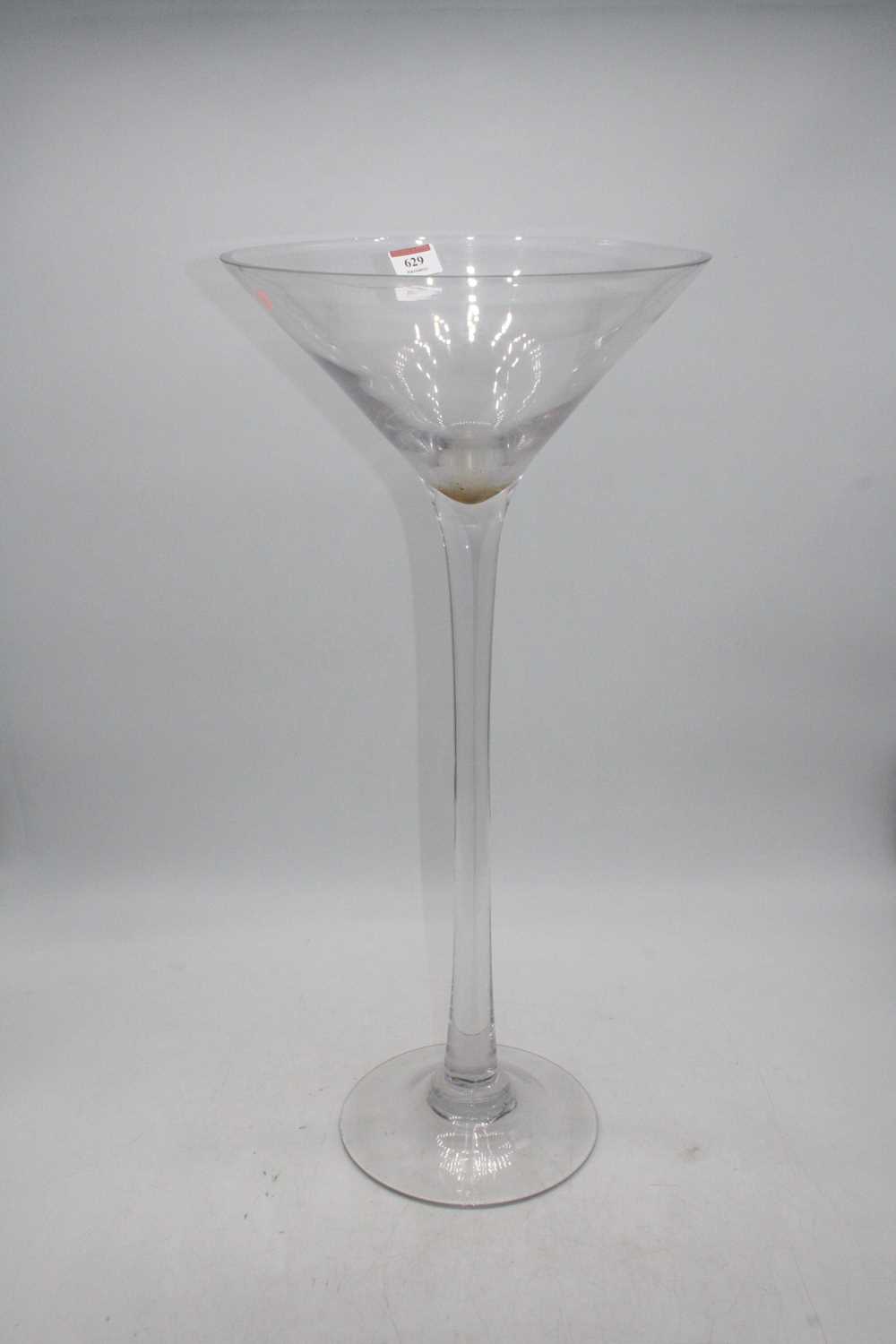 Lot 629 - An oversized Martini glass, h.60cm