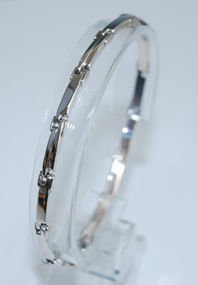 Lot 2563 - A white metal rectangular bar link bracelet,...