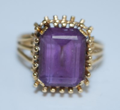 Lot 2540 - A yellow metal amethyst dress ring, featuring...