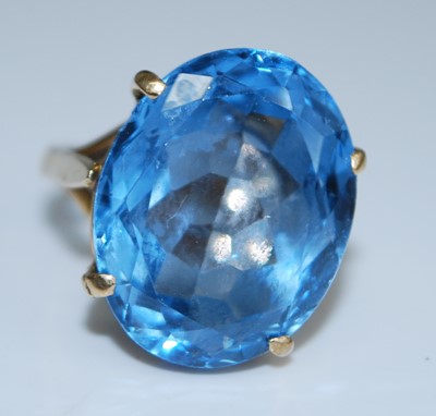 Lot 2541 - A 9ct gold blue topaz dress ring, the oval...