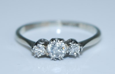 Lot 2543 - A white metal diamond three stone ring,...