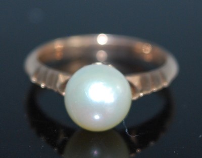 Lot 2544 - A rose metal pearl dress ring, set with an 8mm...