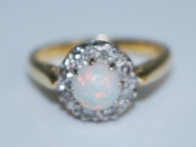Lot 2549 - A yellow and white metal, opal and diamond...
