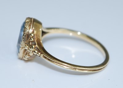 Lot 2550 - A yellow metal aquamarine dress ring, having...