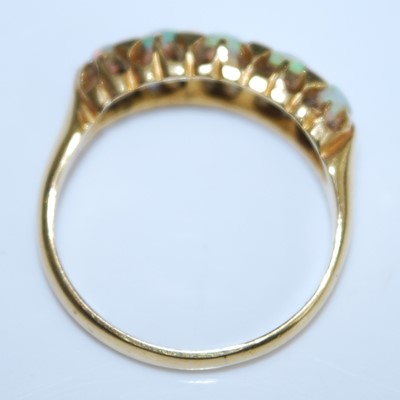 Lot 2555 - An 18ct yellow gold opal five stone half hoop...
