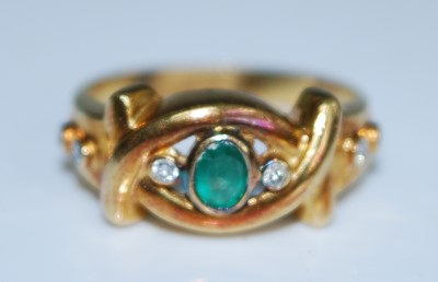 Lot 2556 - A yellow metal, emerald and diamond dress ring,...