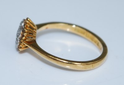 Lot 2560 - An 18ct yellow and white gold diamond circular...