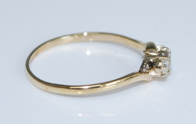 Lot 2561 - A 9ct yellow gold diamond three stone ring,...