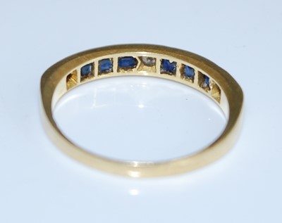 Lot 2571 - An 18ct yellow gold, sapphire and diamond half...