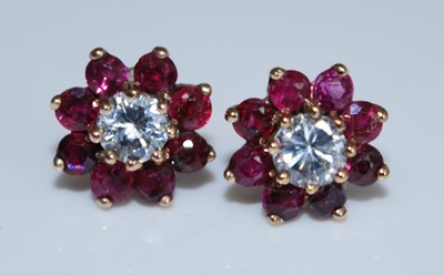 Lot 2572 - A pair of yellow metal, ruby and white...