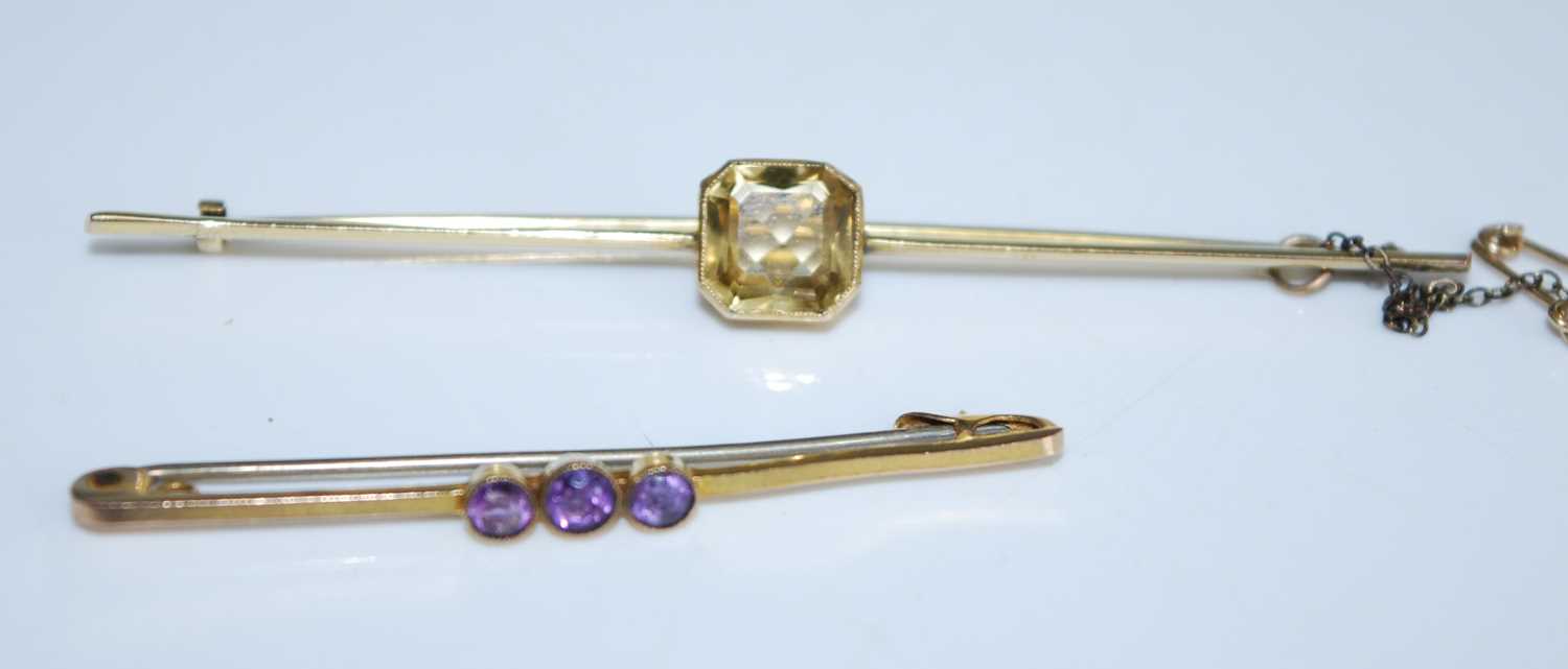 Lot 2570 - Two brooches, one being a yellow metal citrine...