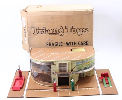 Lot 1917 - A Triang Toys wooden and card garage and...