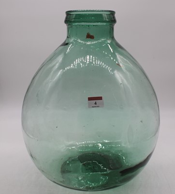 Lot 4 - A green tinted glass carboy height 39cm