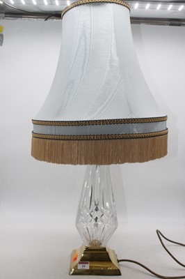 Lot 10 - A modern cut glass table lamp on brass base...