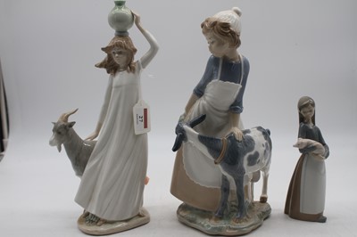 Lot 27 - A large Nao figure of a girl with goat...