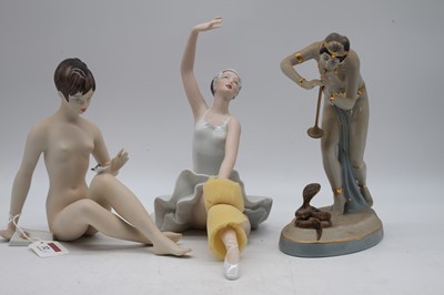 Lot 32 - A Royal Dux figure of a nude lady in seated...
