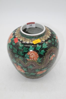 Lot 35 - A reproduction Chinese famille noir vase of...