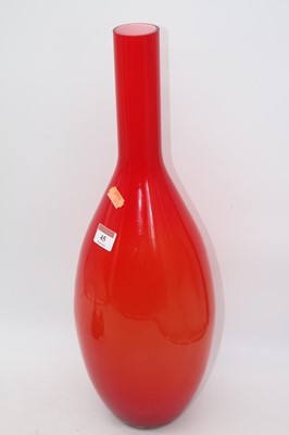 Lot 45 - A large orange tinted art glass bottle vase,...
