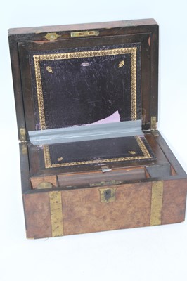 Lot 65 - A Victorian walnut and bras bound writing...