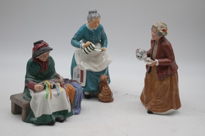 Lot 75 - A collection of three Royal Doulton figures to...