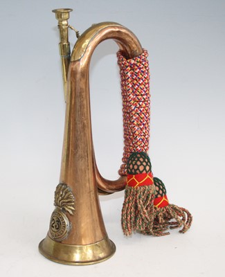 Lot 76 - A copper and brass bugle with applied badge...