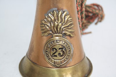 Lot 76 - A copper and brass bugle with applied badge...