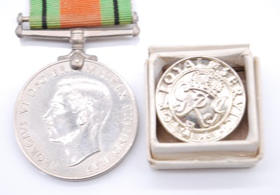 Lot 81 - A WW II Defence and War medal pair, together...