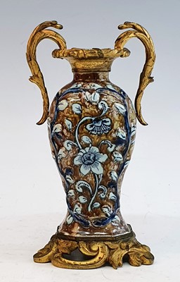 Lot 2048 - An 18th century tin glazed earthenware vase,...