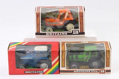 Lot 2158 - A Britains boxed tractor group, all housed in...